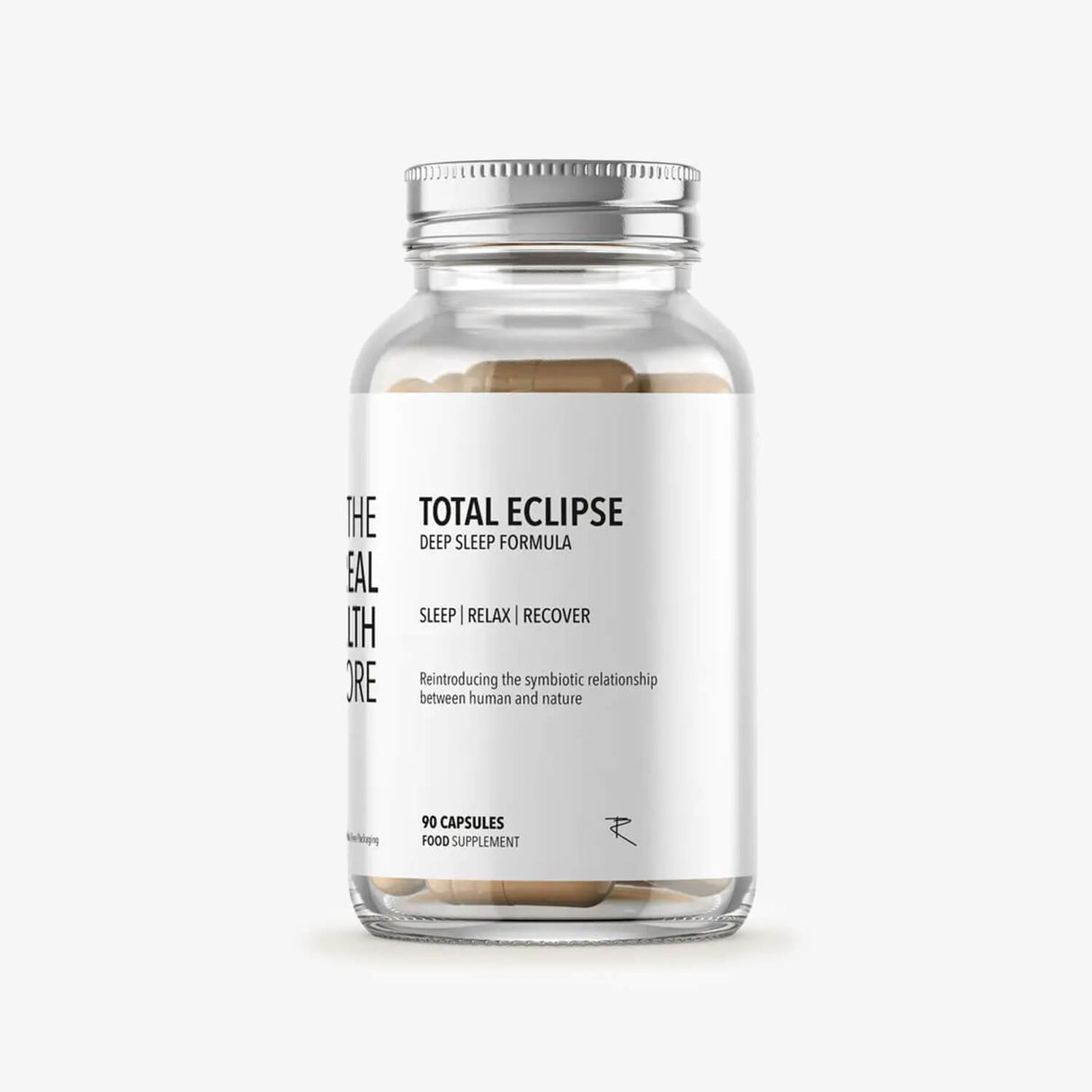 Glass supplement bottle labeled 'Total Eclipse' on a white background