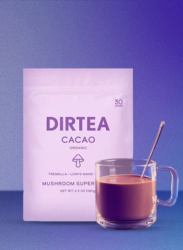 Dirtea Cacao mix next to a glass mug of cacao with a gradient background