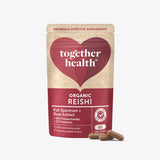 Packaging of Together Health Organic Reishi supplement with a red and beige design, featuring capsules spilling out in front.